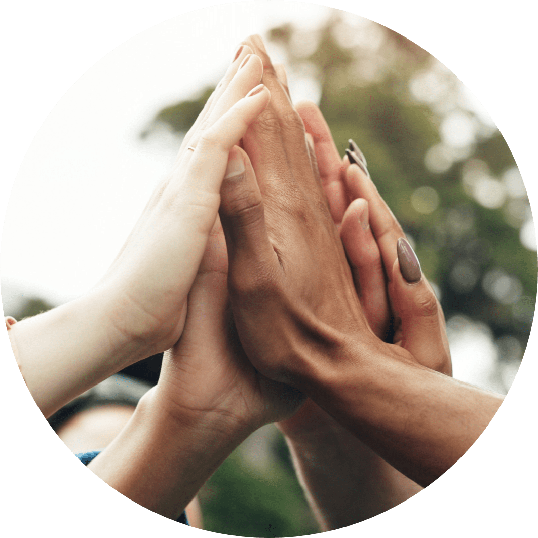Image of a bunch of hands coming together for a high five